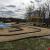 A view of the track and stand from the high hill picnic area.  The temporary blue tarp was there to control erosion during the winter.  